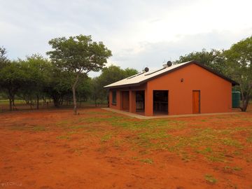 Fully equipped ablution block with showers, toilets, wash basins, dish sinks and fridge