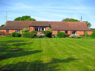 A beautifully-furnished, single-storey barn divided into holiday cottages