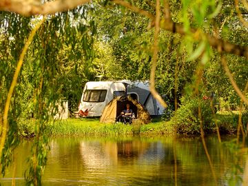 Pitches tucked away by the river