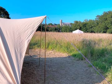 View from bell tents with church in the background.