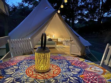 View from the dining area to the inside of the tent. complete with solar lighting