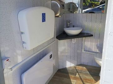 Family shower room with baby change facilities