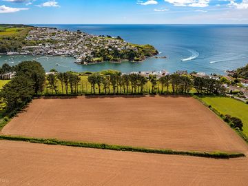 Aerial view of the site looking out over Fowey and Polruan