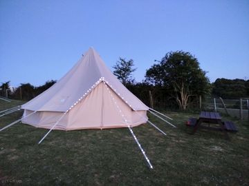 Robin Bell tent exterior and seating area outside