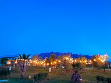 The site lit up at night