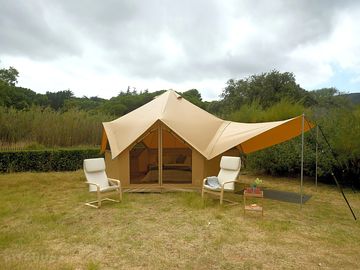 Glamping tent with outdoor seating