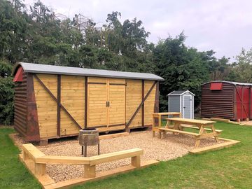 Outside Maribelle there is a BBQ area with sleeper benches and a picnic table and prep area