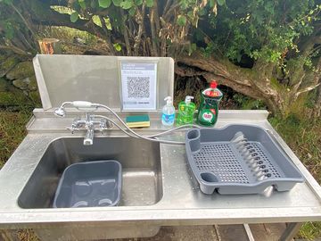Track and trace and shower head at washing facility’s