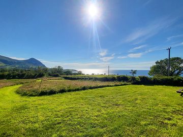Grass pitch with sea views