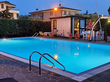 The pool and bar by night