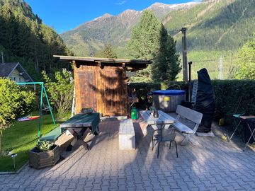 Wooden toilet block, hot tub and picnic tables