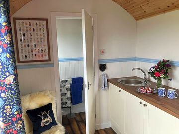 Kitchenette and entrance to the bathroom
