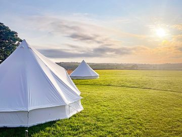 Sunset behind the bell tents