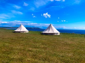 Bell tents under the clear skies