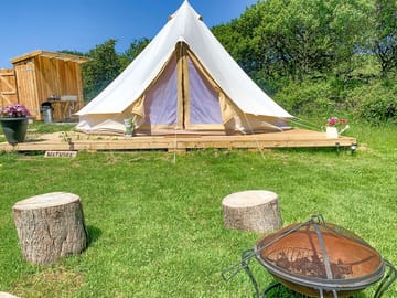 Bell tent set up with private facilities
