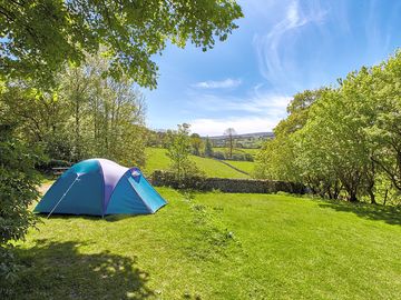 Grass pitch with rural surroundings