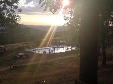 The swimming pool at sunset, view from the caravan