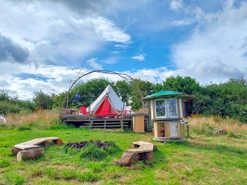 Your camp area, with tent, firepit and kitchen