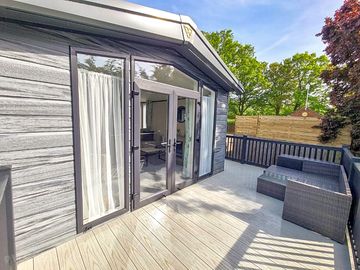 Lodge decking area with outdoor furniture