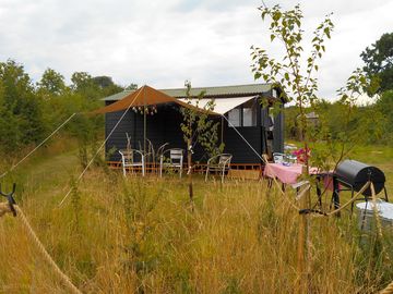 An awning and barbecue are all provided