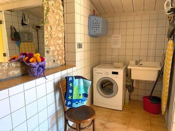 Modern shower block with two showers, two toilets, two washbasin cubicles and two washing-up sinks