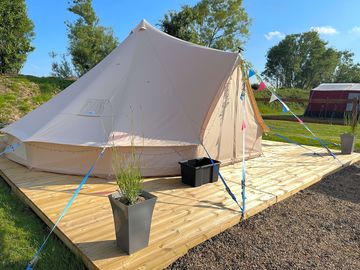 Bell tent includes 1 double bed and 2 single beds (no bedding)