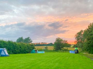 Visitor image of the pitch area, with sunset view