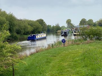 Watch the boats drifting down the canal