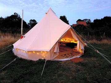 Outside one of the bell tents