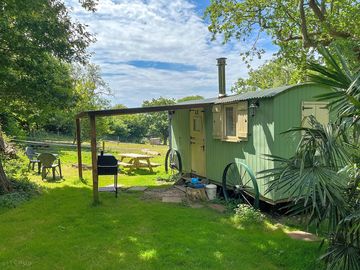 Woodkeepers Hut 4 berth with double and bunk beds showing private garden.