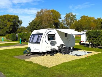 Fully serviced pitch with hard standing and shingle awning base