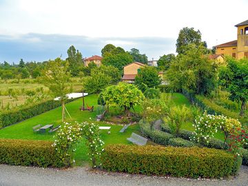Pretty garden with picnic tables and hammocks