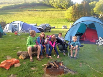 A family enjoying the fun of an evening around a camp fire (added by manager 14 Jul 2015)