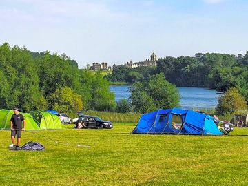 Camping field overlooking Castle Howard and lake.