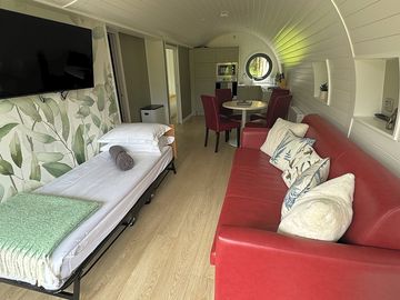 Living area with fold out single bed for 5 guests