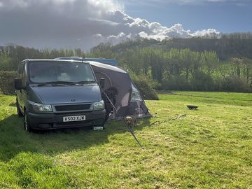 Grass pitches with woodland views
