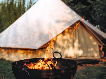 Campfire next to the bell tent