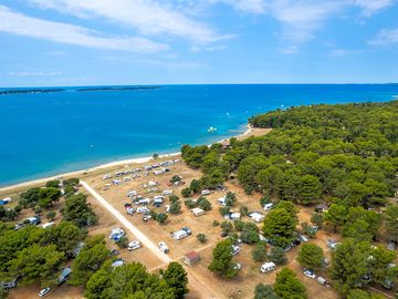 Enjoy the comfort of accommodation in the pine forest, olive grove shade, or right by the sea!