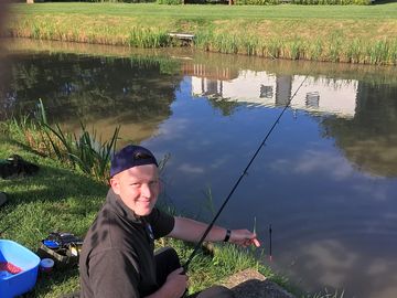 Fishing in the lake by the caravan