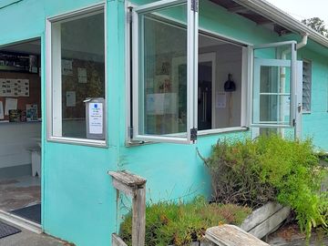 Outside space of kitchen, biofold windows.