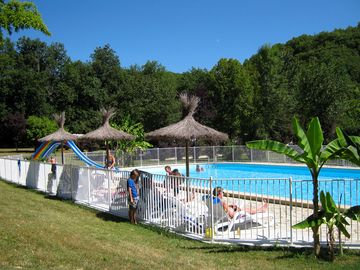 Swimming pool with sun loungers