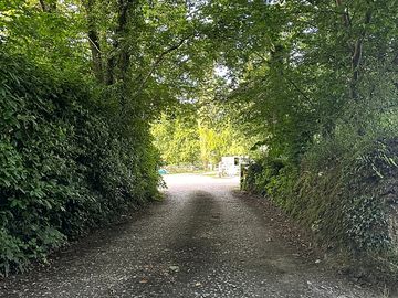 The entrance into the yard, where you are greeted by us and shown where the camping field is.