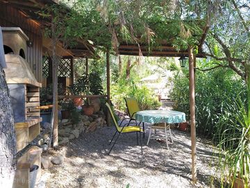 Barbecue, kitchen and shaded dining area