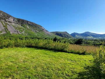 Grass pitch overlooked by gyrn ddu