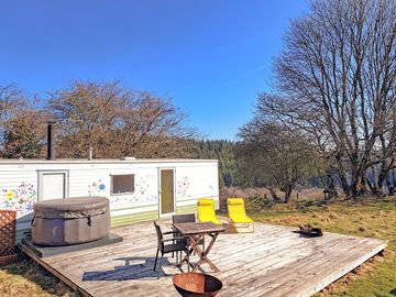 Nestling amongst the trees with a spacious decking and beautiful views