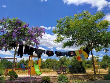 Washing line with playground behind