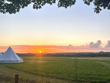 Watching the sunset behind our bell tents