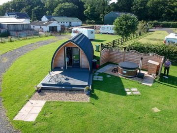 Decking and hot tub outside the pod