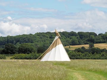 Binknoll tipi with the Marlborough Downs in the background