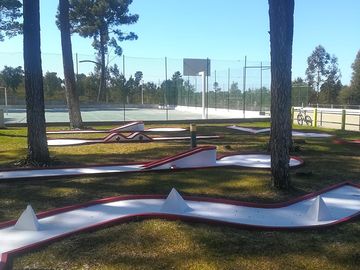 Miniature golf with sports courts behind